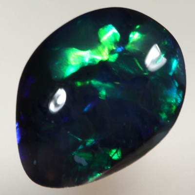 SOLID BLACK OPAL  Bright and rich rolling flashes of turquoise, green and blue
